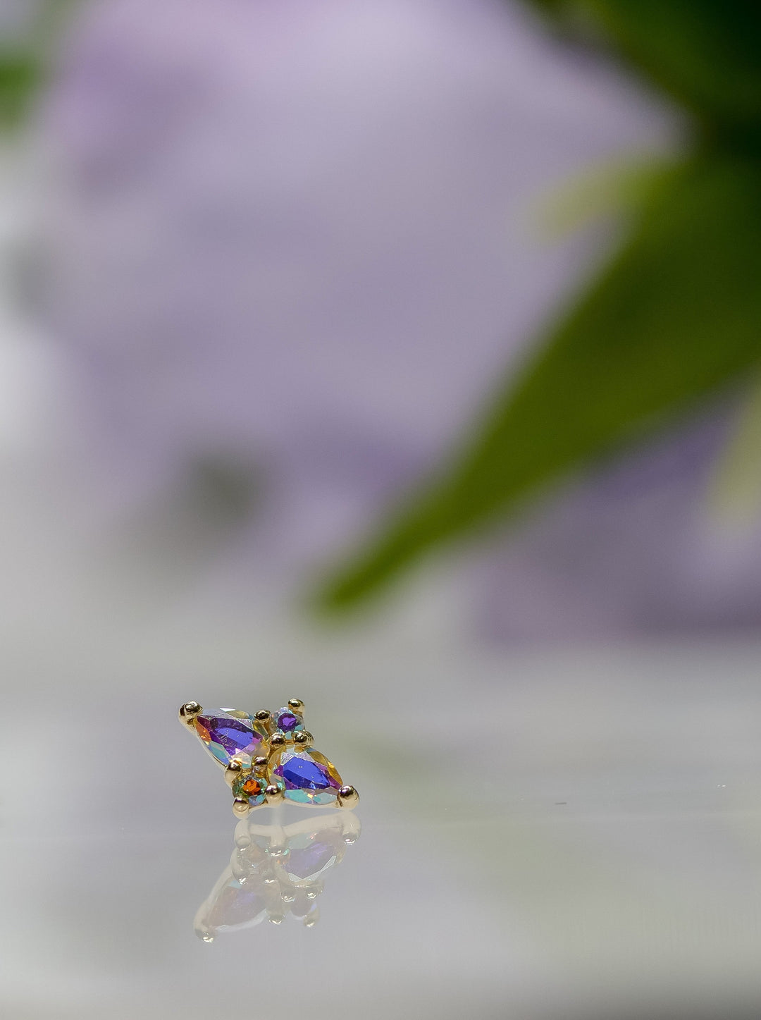 rainbow threadless end featuring large gems mercury mist topaz