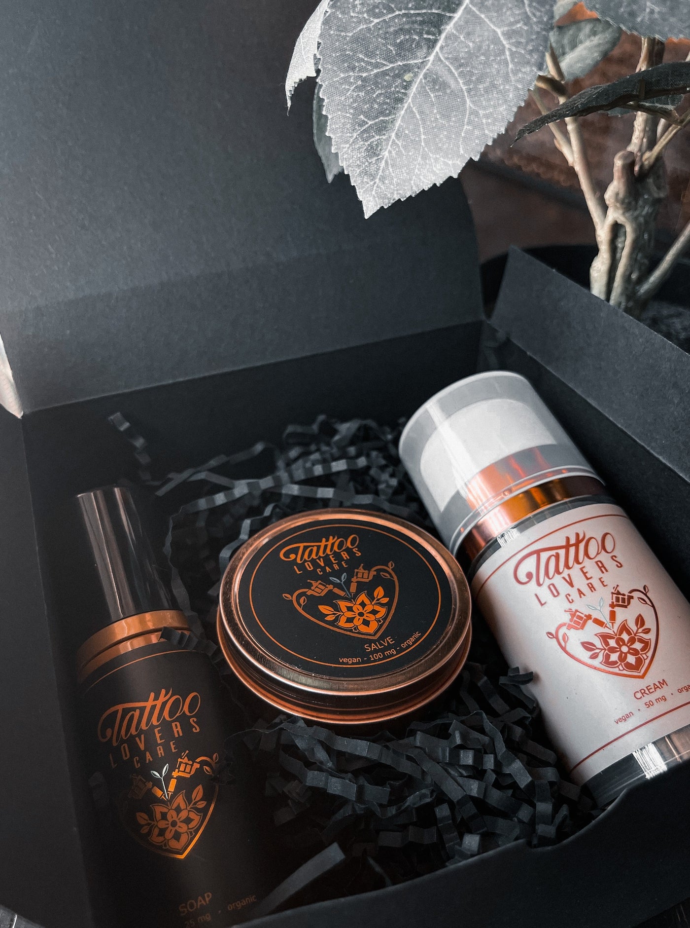combo box of aftercare salve, body wash, and lotion from tattoo lovers