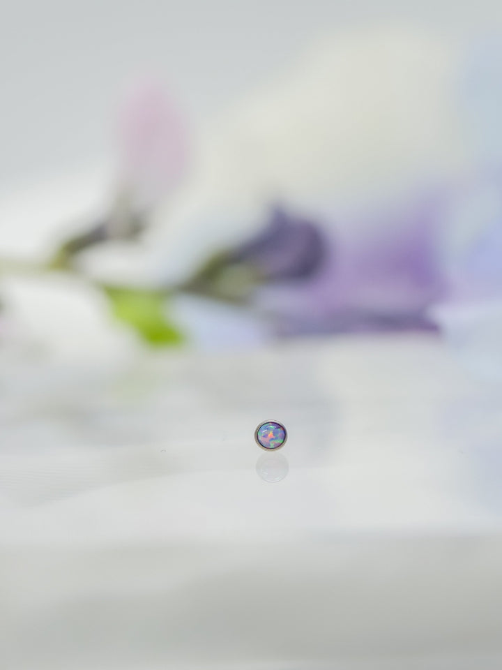 small opal soft purple in flat bezel set threadless end by neometal