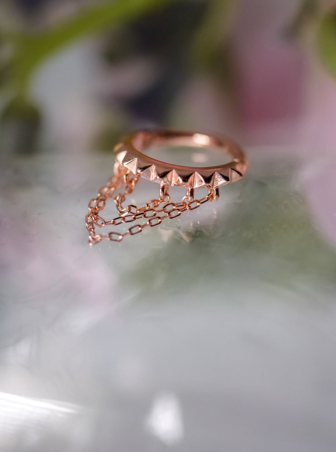 beautiful rose gold hoop with dangling chains for septum piercings