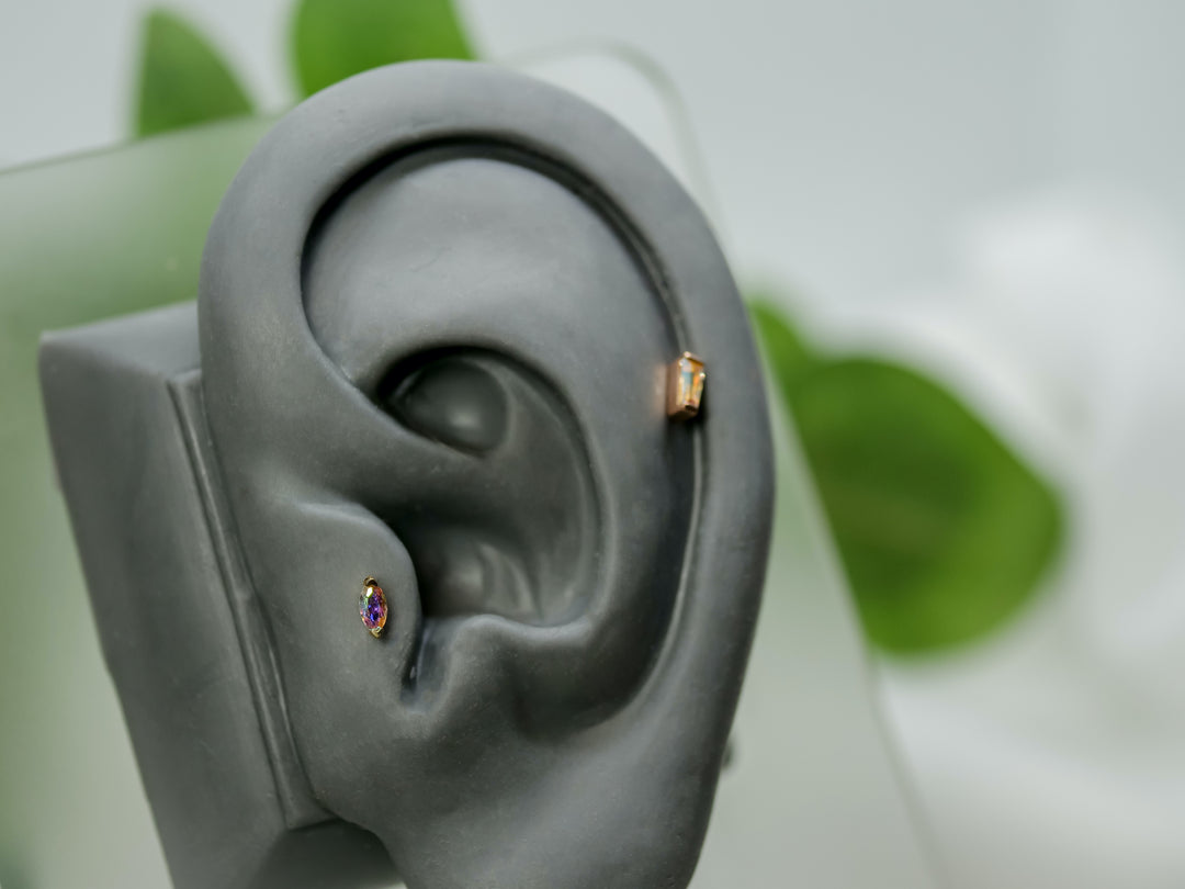 tragus piercing with small mercury mist rainbow topaz gem threadless end 