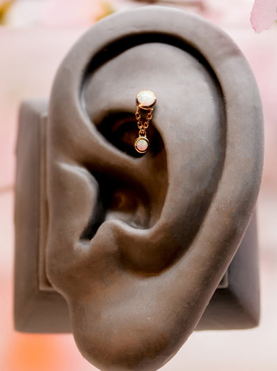 rook piercing with dangley charm with white opal gem threadless end 