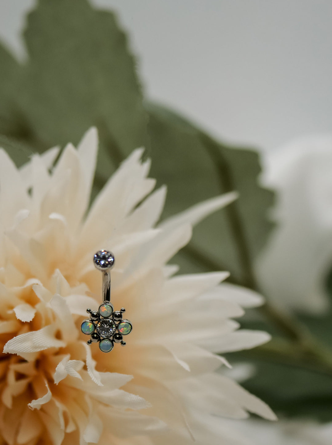 internally threaded navel curved belly bar with cubic zirconia and white opals