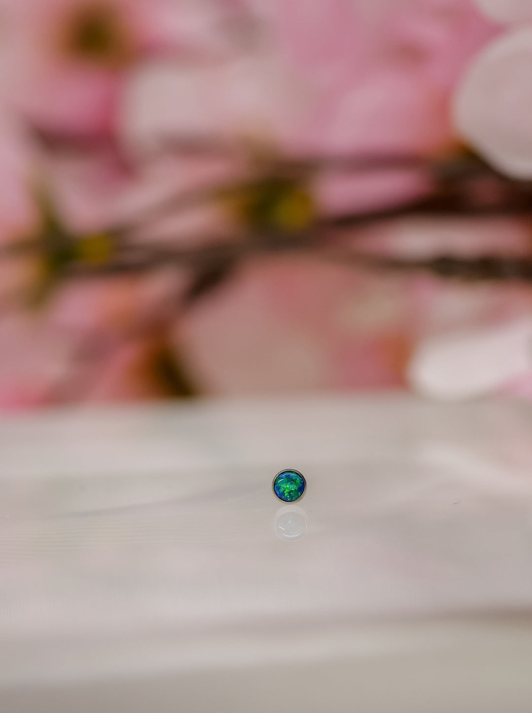 small peacock coloured opal end - blue and green flecks, perfect for cartilage or nostril piercings